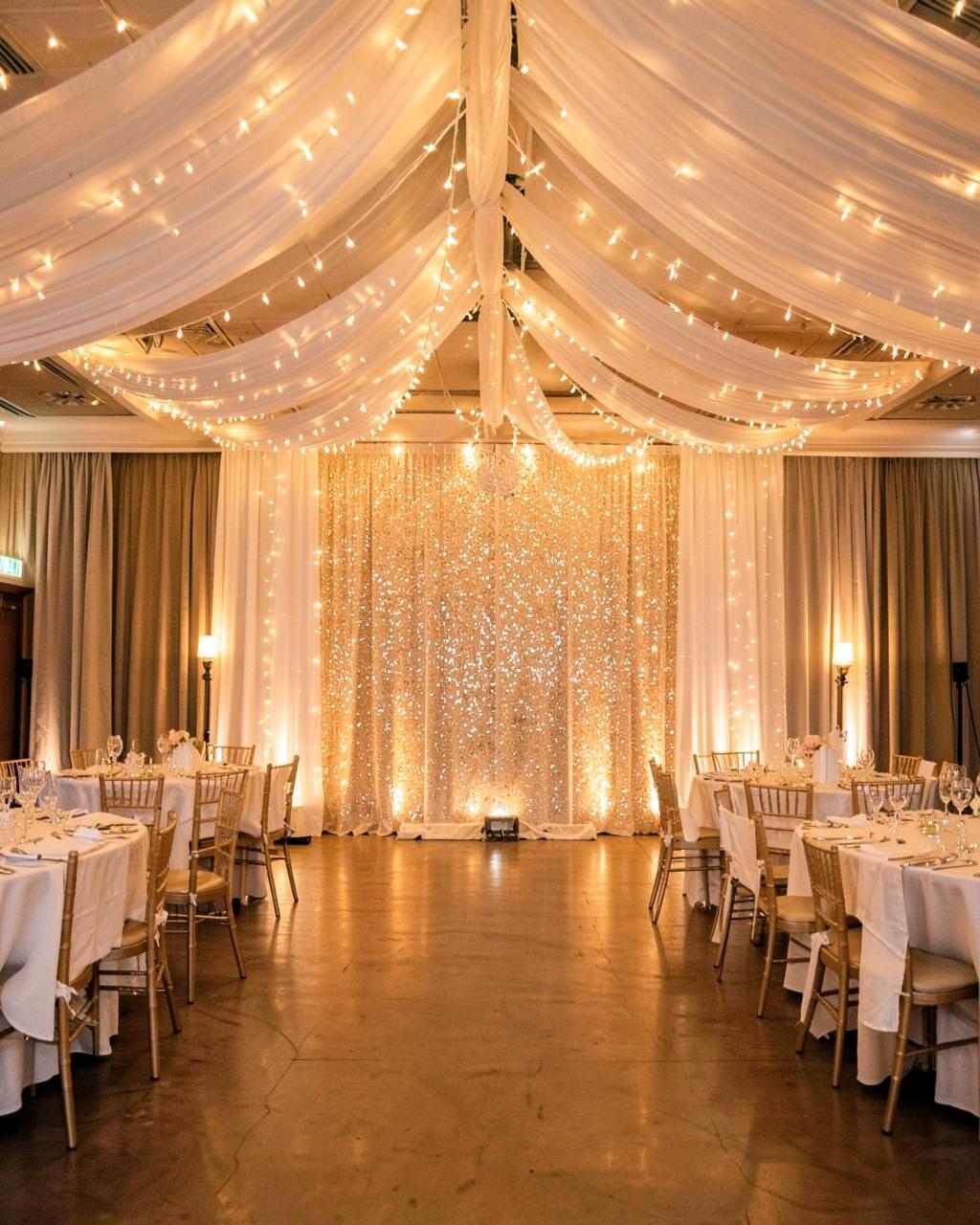 Full venue transformation with ceiling drape and lighting in Manchester